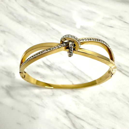 Bracelet jonc en acier inoxydable doré – Nœud strass élégant